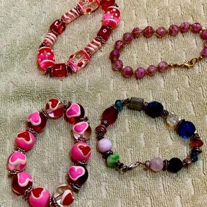 Four glass-bead bracelets